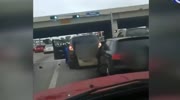 Smart dude steals a car while women fight in a road rage argue