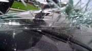 THE MAN JUMPS TO THE WOMAN'S CAR IN THE WINDSCREEN