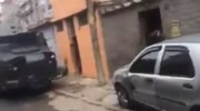 ARMORED POLICE CAR RAMS VEHICLES IN SLUMS