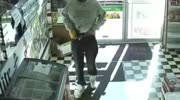 thief covers his weapon with plastic bag