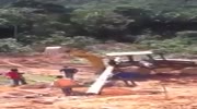 Pole falls crushining excavator operator`s legs