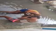 aggressive women fight in the water