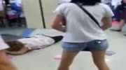 hysterical girl beats and kicks a woman