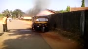 Men attenpt to put out a fire with water