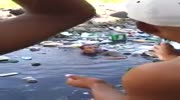 Thief swims in trash trying to escape punishment