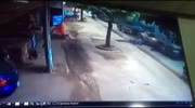 Motorcycle slips under gravel causing the two riders to be ran over by a truck