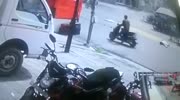 Rider falls under the truck wheels