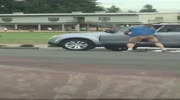 naked man is dragged by the car