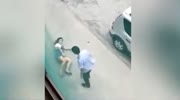 Man beating and kicking his wife
