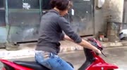Driving a RED bike by a woman...