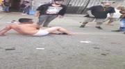 Robber gets beaten and stripped