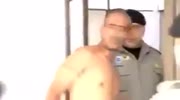 Arrested thug attacks a reporter