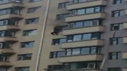 Man jumps out of a burning apartment