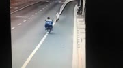 Motorcyclist doesn't see a row of traffic pylons