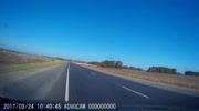 Reckless driver tries to overtake a truck and overturns