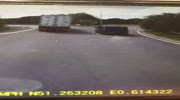 Truck overturns crushing a van