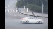 Scooter driver sent spinning over car roof