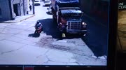 Woman crossing the road close to the truck gets run over