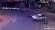 A motorcycle driver flies for a moment because of a collision with a truck