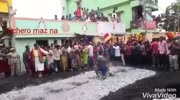 Woman falls on a burning coal while a local ritual