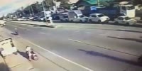 Woman on a scooter gets run over and stuck alive under the truck