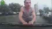 Crazy men try to attack car.