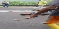 Motorcyclist in pain after crash.