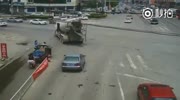 Two guys on a scooter disappear under the truck