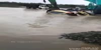 Truck driver drowns when his overloaded vehicle overturns