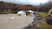 Flood of a river pulls a house on its way