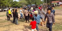 Guy is beaten by an open air crowd