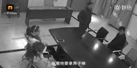 Woman knocks her boss with a chair