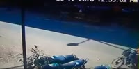 Biker falls under the truck