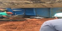 Bulldozer operator is stuck under his vehicle