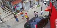 Lost control car hits a biker sending him off the hill