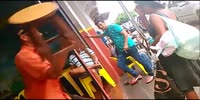 Drunk man knocks a woman with a chair