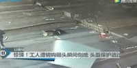 Hooks slip off steel sheets and hits a co-worker in the head