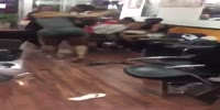 Big black females fight in a restaurant
