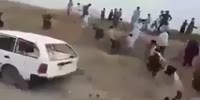 Pakistan villigers stone a car