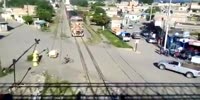 Careless cyclist gets knocked by a train