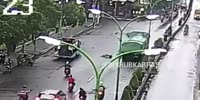 Man on bicycle sticks his head under the wheels of the truck