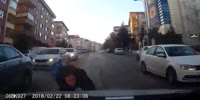 Pedestrian woman leaves unexpectedly between cars wanting to cross the street