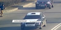 Dude in a headphones runs across the busy highway and pays the price