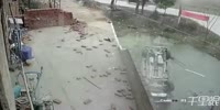 Speeding SUV destroys the wall and falls into the pond
