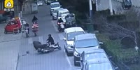 Two scooter riders collide