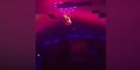 Acrobat falls on stage