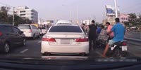 Girl on scooter crashes in traffic