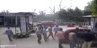 Man sitting on a bike gets crushed by lost control car