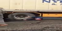 Man Still Alive Stuck Under The Wheels Of A Truck.