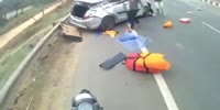 Biker plows into a rolling car